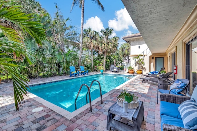 view of swimming pool with a patio