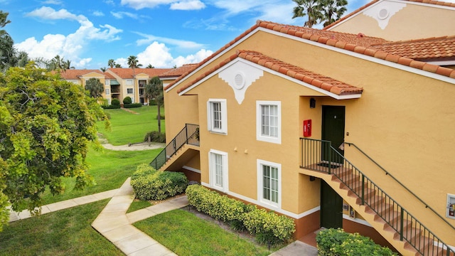 view of home's exterior with a yard