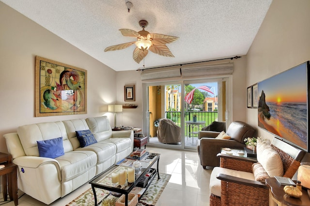 tiled living room with lofted ceiling, a textured ceiling, and ceiling fan