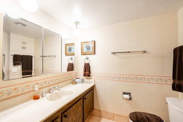 bathroom featuring toilet, vanity, and tile patterned floors