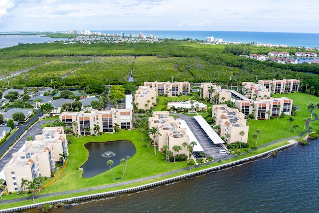 birds eye view of property with a water view