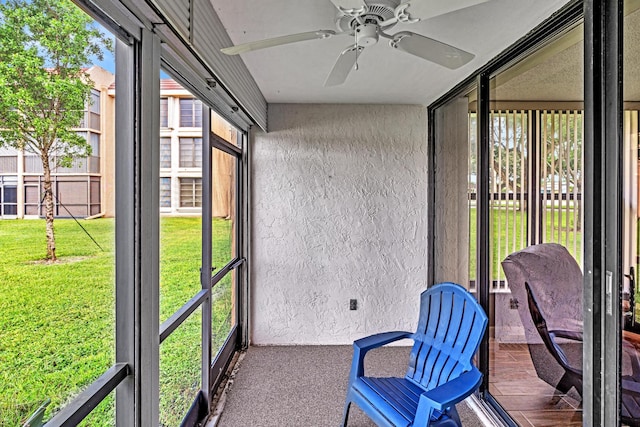 sunroom / solarium with ceiling fan