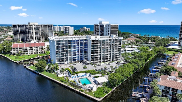 birds eye view of property with a water view