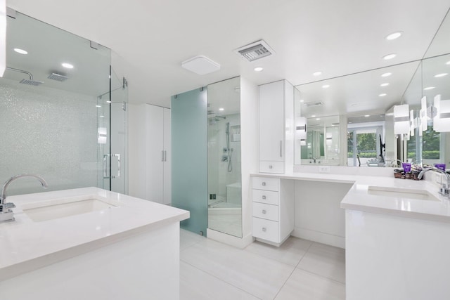 full bath with two vanities, a stall shower, visible vents, and a sink