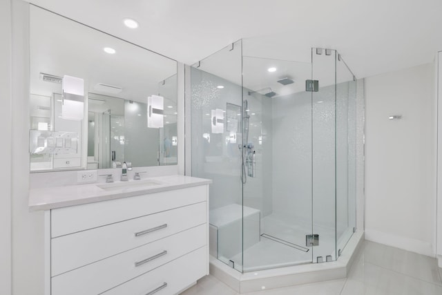 full bathroom with a stall shower, tile patterned floors, vanity, and recessed lighting