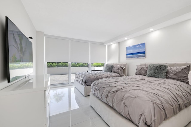 bedroom featuring floor to ceiling windows, recessed lighting, and access to exterior