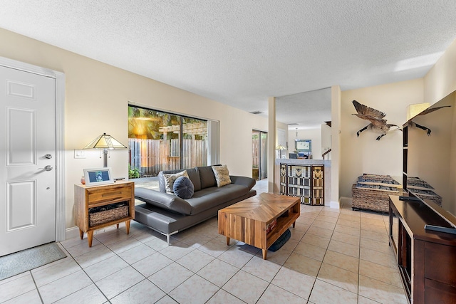 tiled living room with a textured ceiling