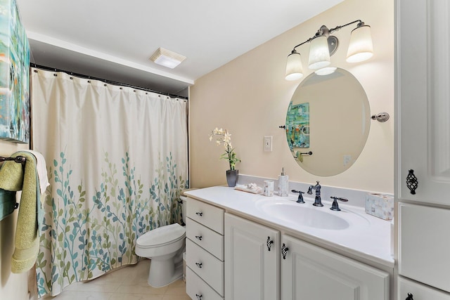 bathroom with vanity, curtained shower, toilet, and tile patterned floors