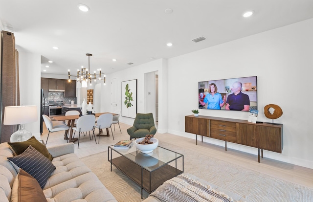 living room featuring a notable chandelier