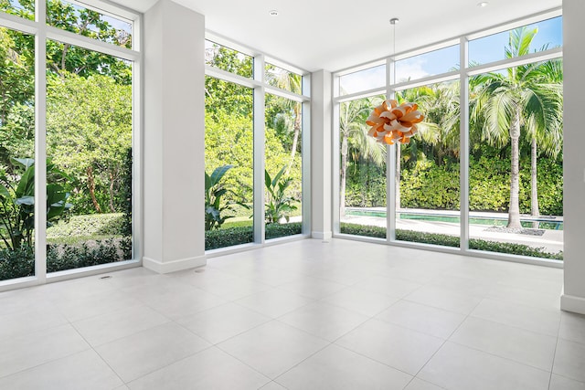 unfurnished sunroom featuring plenty of natural light