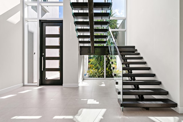 tiled entryway featuring plenty of natural light