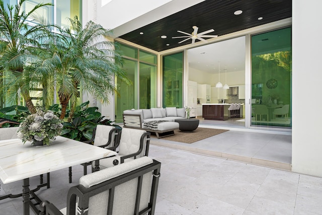 view of patio with outdoor lounge area and ceiling fan