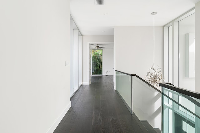 corridor with dark hardwood / wood-style floors