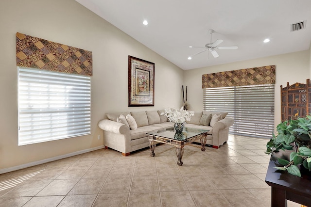 tiled living room featuring ceiling fan and lofted ceiling