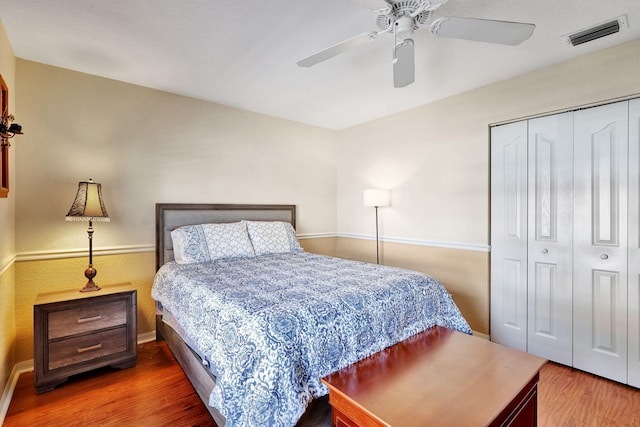 8503 Logia Cir, Boynton Beach, FL 33472 - bedroom with a closet, baseboards, ceiling fan, visible vents, and wood finished floors