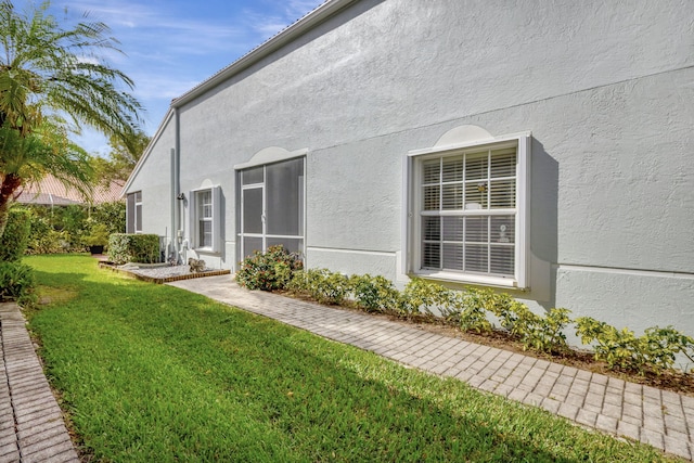 view of home's exterior featuring a yard