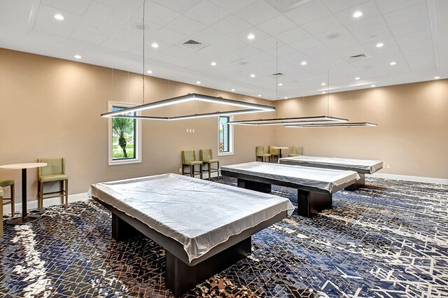 recreation room with pool table and dark colored carpet