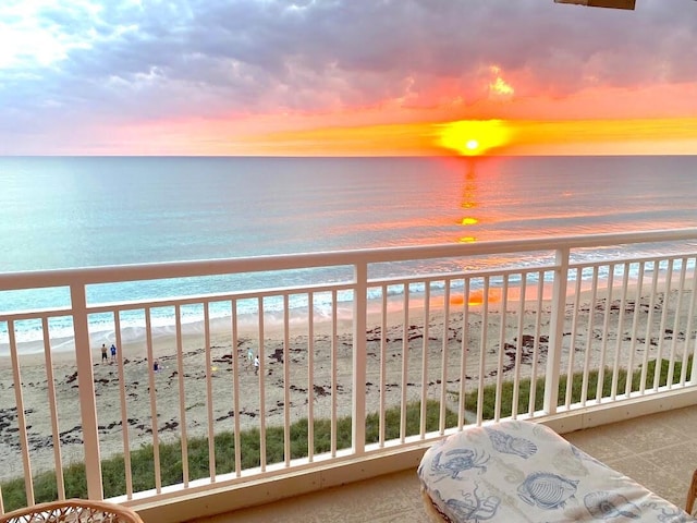 10980 S Ocean Dr Unit 714, Jensen Beach, FL 34957 - balcony at dusk featuring view of water and beach