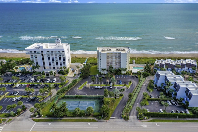 aerial view with a beach view and a water view