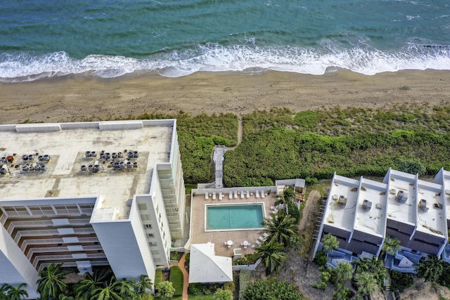 bird's eye view with a water view and a beach view