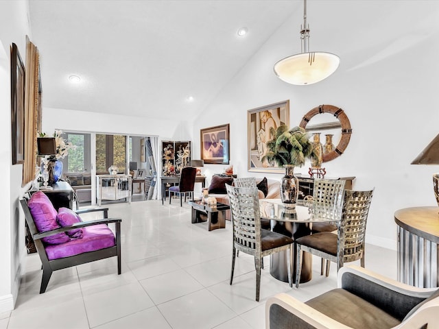 tiled dining space with high vaulted ceiling