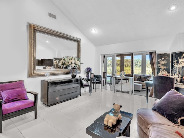 living room featuring french doors, high vaulted ceiling, and light tile patterned flooring