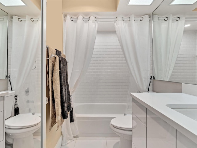 full bathroom featuring toilet, shower / bath combo with shower curtain, vanity, and tile patterned floors