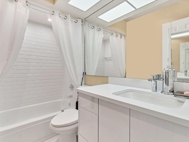 full bathroom with vanity, toilet, shower / bath combo with shower curtain, and a skylight