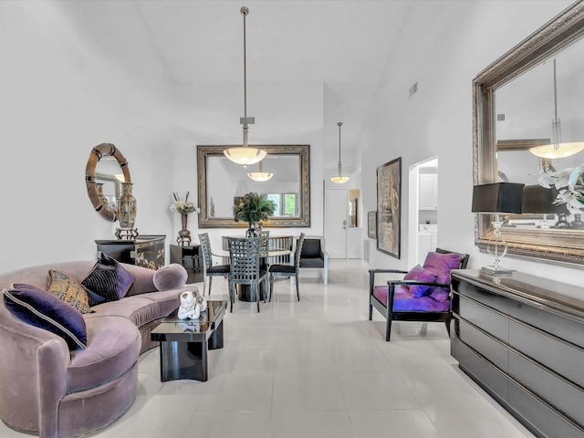 living room with high vaulted ceiling