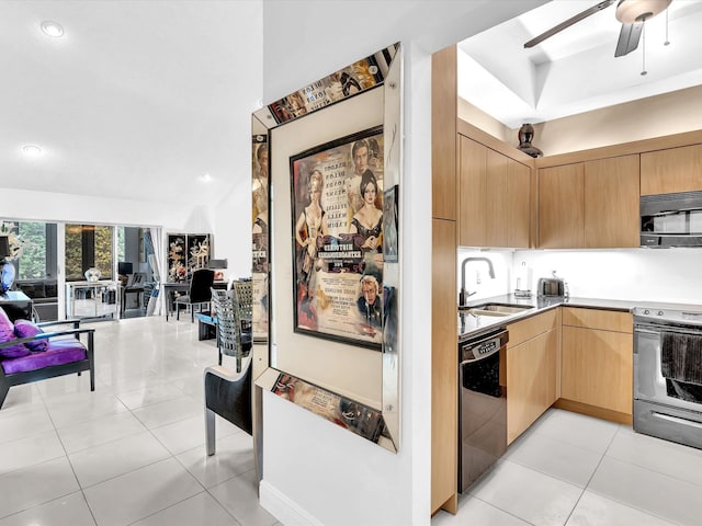 kitchen with light brown cabinetry, sink, appliances with stainless steel finishes, and light tile patterned floors