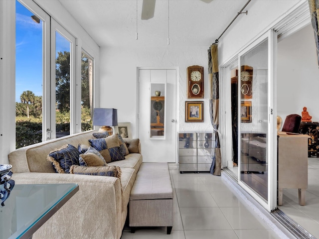 sunroom featuring ceiling fan