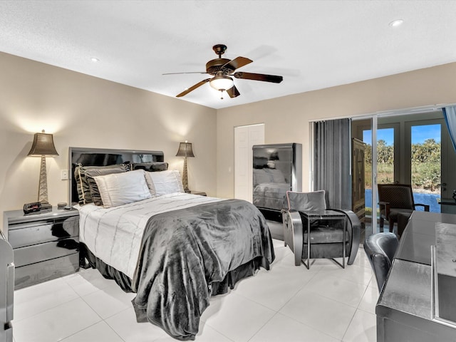 tiled bedroom with access to outside and ceiling fan