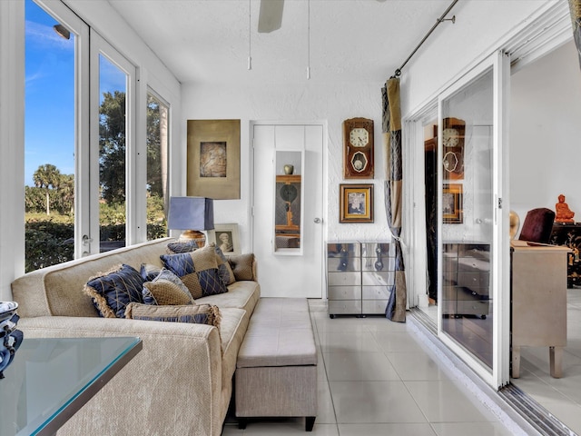 sunroom / solarium featuring ceiling fan