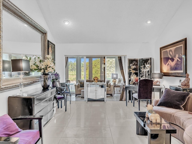 tiled living room with french doors and vaulted ceiling