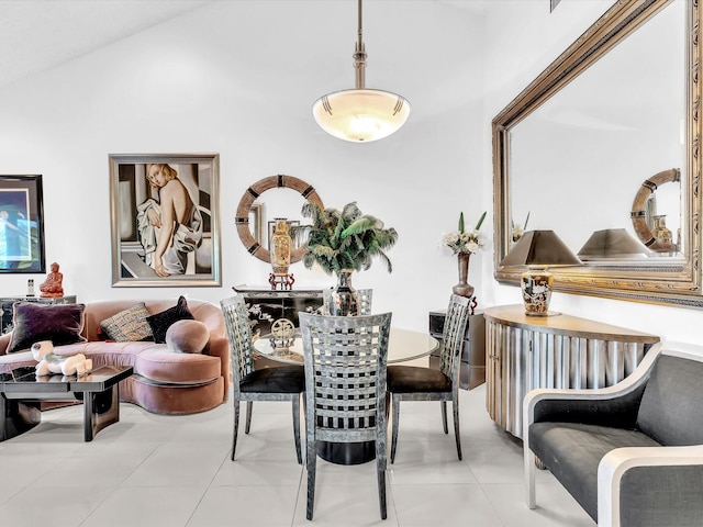 interior space featuring vaulted ceiling and light tile patterned flooring