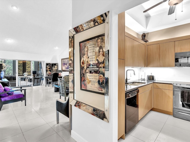 kitchen featuring light brown cabinetry, sink, stainless steel appliances, and light tile patterned floors