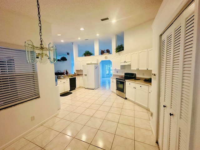 kitchen with hanging light fixtures, white cabinetry, stainless steel electric range, and white fridge with ice dispenser