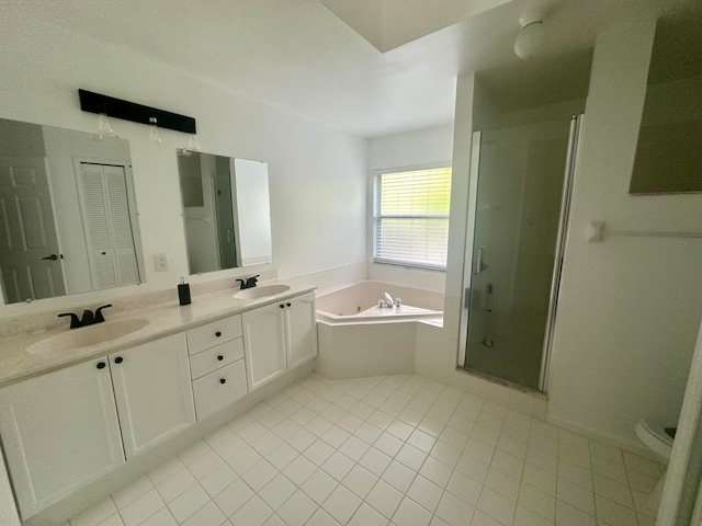 full bathroom featuring vanity, independent shower and bath, toilet, and tile patterned floors