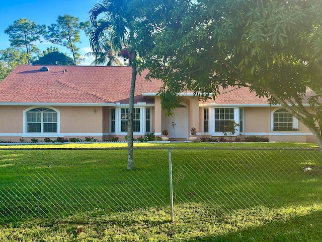 ranch-style home with a front yard