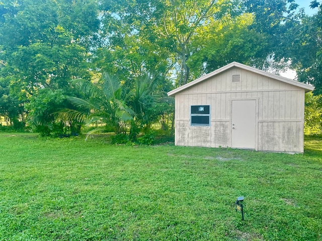 view of outdoor structure with a yard