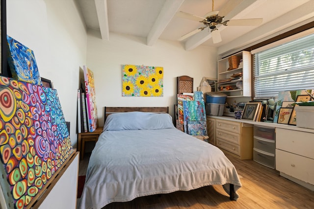 bedroom featuring beam ceiling, ceiling fan, and light hardwood / wood-style floors