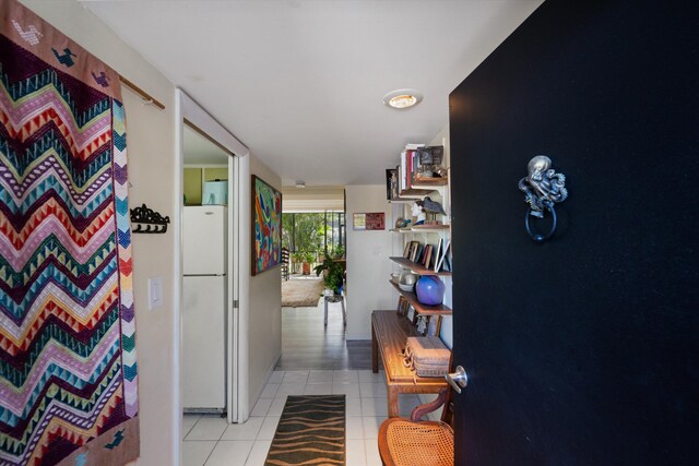 hallway with light tile patterned flooring