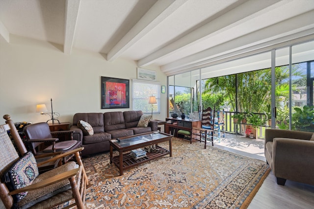 living room with beam ceiling and hardwood / wood-style floors