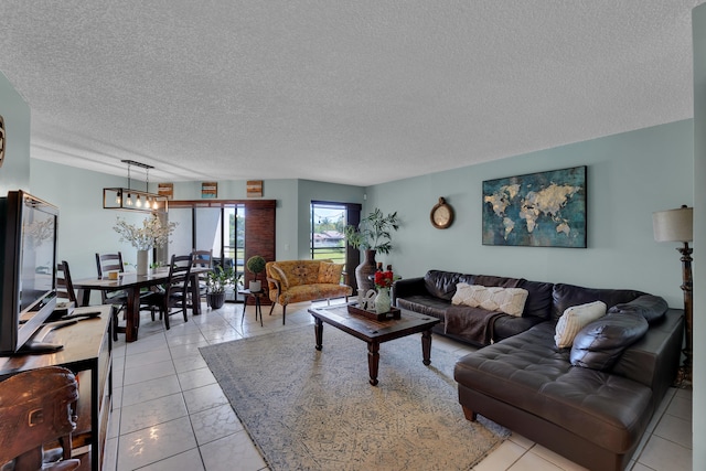 tiled living room featuring a textured ceiling