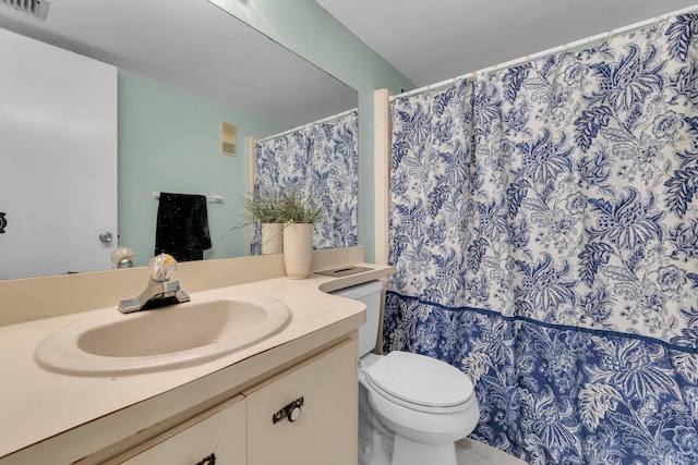 bathroom with vanity and toilet