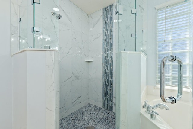 bathroom featuring separate shower and tub