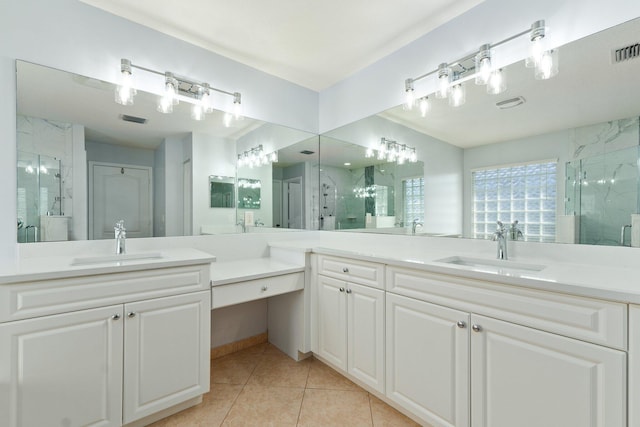 bathroom with vanity, tile patterned floors, and walk in shower