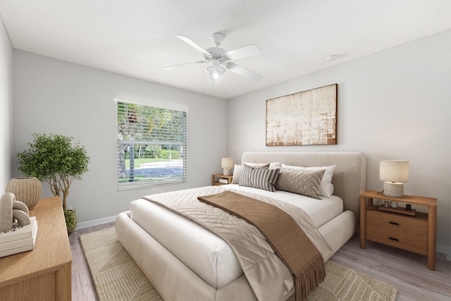 bedroom featuring hardwood / wood-style flooring and ceiling fan