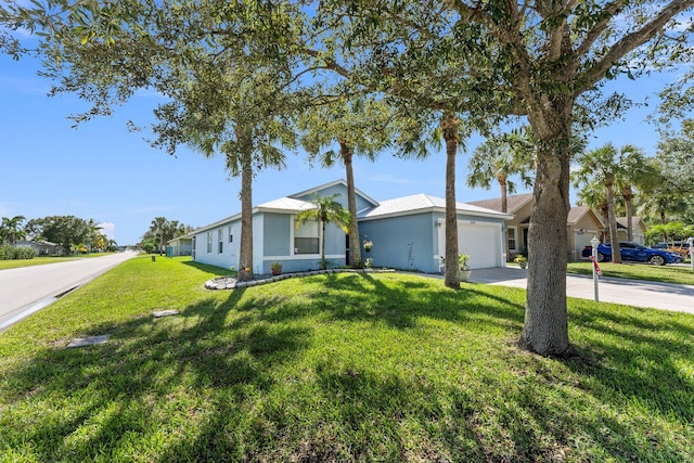 ranch-style home featuring a front yard and a garage