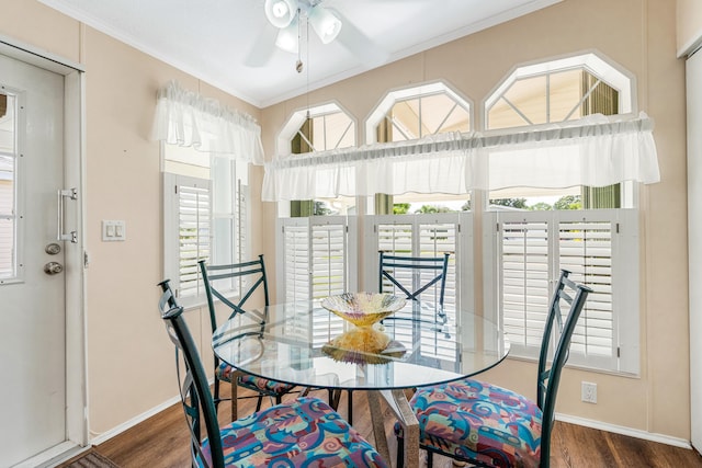 dining space featuring crown molding, dark hardwood / wood-style floors, and plenty of natural light